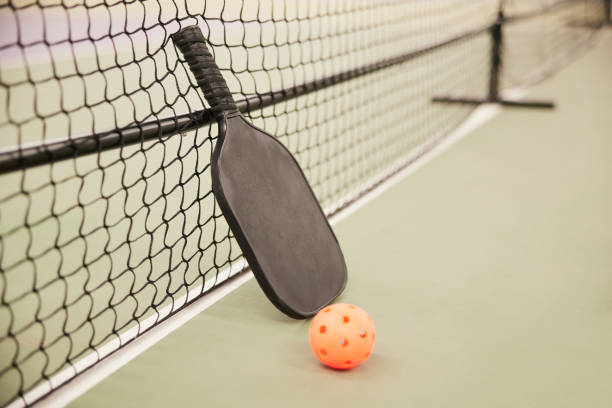 istock Pickleball detail racket and ball. 1407472401