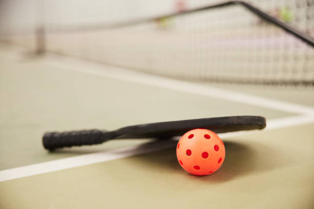 istock Pickleball detail racket and ball. 1407472415