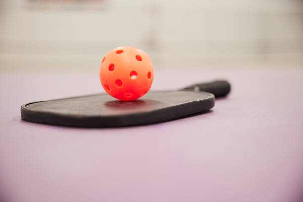 istock Pickleball detail racket and ball. 1407472428