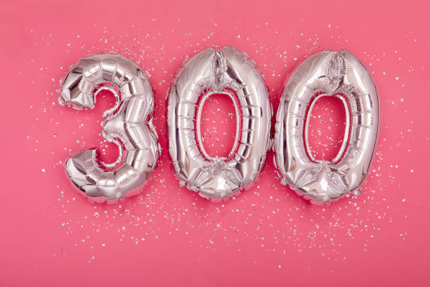 istock Silver balloon showing number 300 three hundred pink background 1407474151