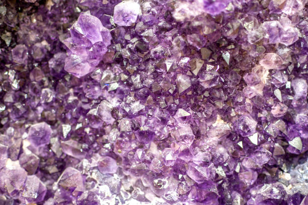 istock Close up methyst Violet Crystal Cave stone 1407476517