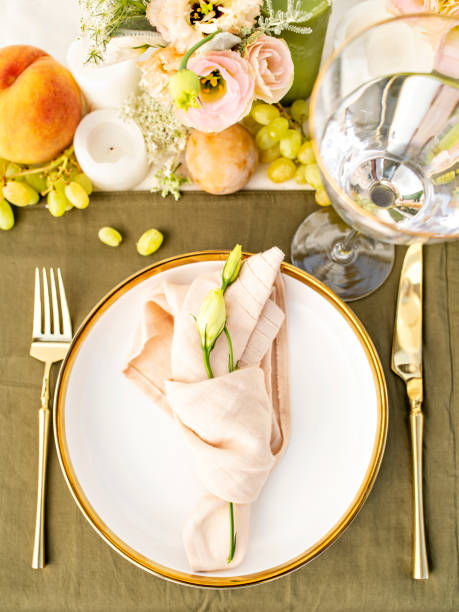 istock Festive colourful table setting. Restaurant, wedding, party decorated with flowers, candles, fruits and leaves. Midsummer or autumn mood event, romantic dinner. Florist decorator occupation. 1407479862