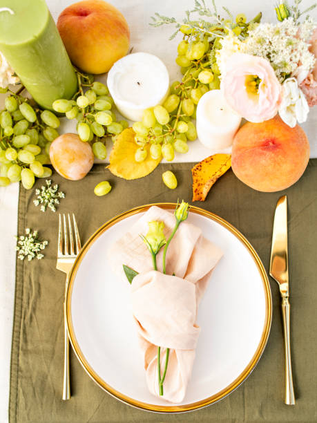 istock Festive colourful table setting. Restaurant, wedding, party decorated with flowers, candles, fruits and leaves. Midsummer or autumn mood event, romantic dinner. Florist decorator occupation. 1407479872