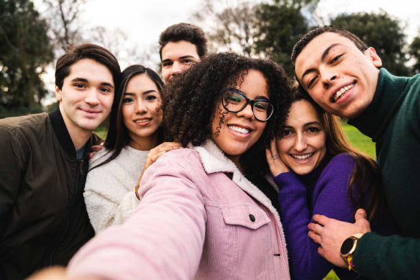 istock Multi ethnic group of six friends taking a selfie together 1407480169
