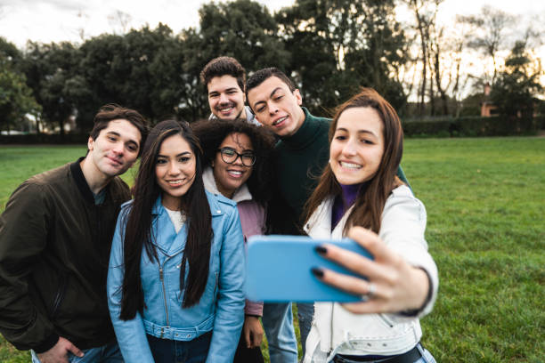 istock Multi ethnic group of six friends taking a selfie together 1407480193
