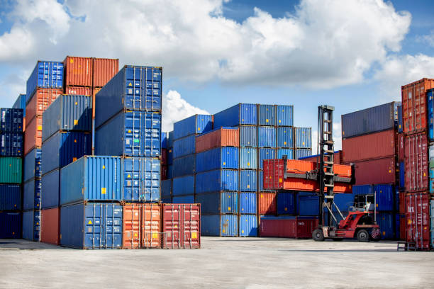 istock Logistics of international container cargo shipping and cargo plane in container yard, Freight transportation, International global shipping. 1407480901