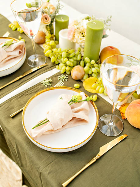 istock Festive colourful table setting. Restaurant, wedding, party decorated with flowers, candles, fruits and leaves. Midsummer or autumn mood event, romantic dinner. Florist decorator occupation. 1407481622