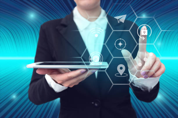 istock Lady in suit holding tablet symbolizing successful teamwork accomplishing newest project plans. Woman carrying electrical device representing combined effort management. 1407486853