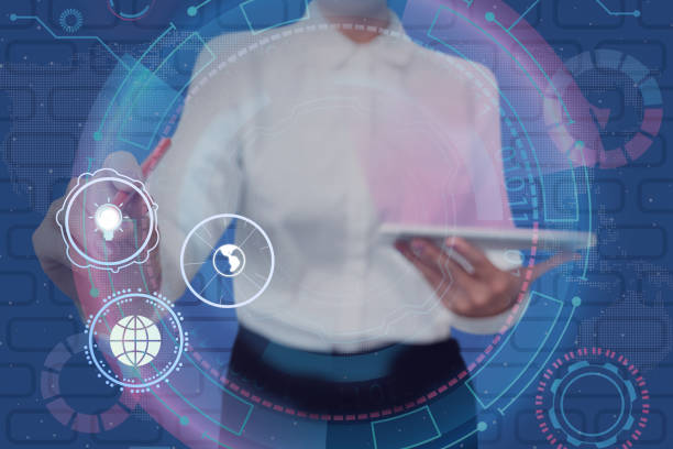 istock Lady in suit pointing pen holding tablet achieving global innovative thinking accomplishing teamwork. Woman points pencil symbolizing global innovative thinking. 1407486871