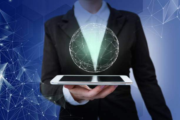 istock Lady in suit holding tablet symbolizing global innovative thinking accomplishing teamwork. Woman carrying electrical device achieving global innovative thinking. 1407486876