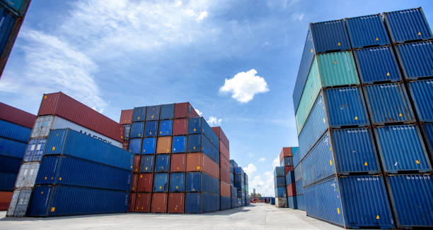 istock Logistics of international container cargo shipping and cargo plane in container yard, Freight transportation, International global shipping. 1407486958