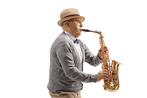 Senior man saxophone player isolated on white background