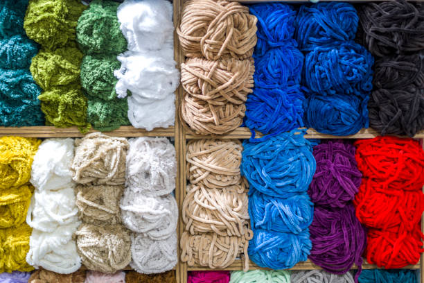 istock Close up shot of colored wool yarn balls as background 1407489364