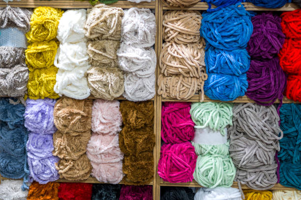 istock Close up shot of colored wool yarn balls as background 1407489914