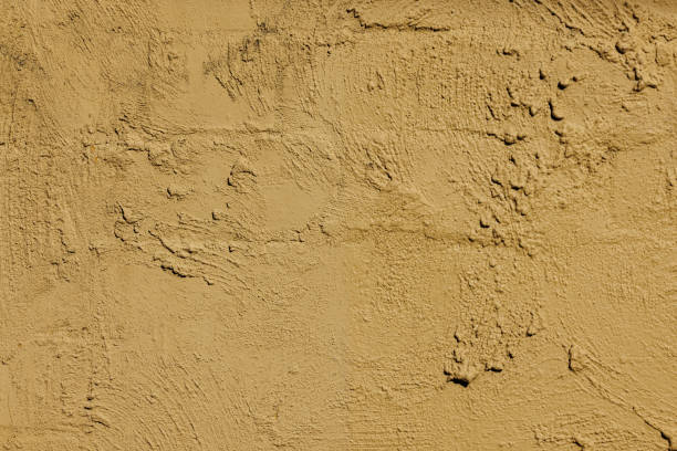 istock Part of a textured beige wall 1407490029