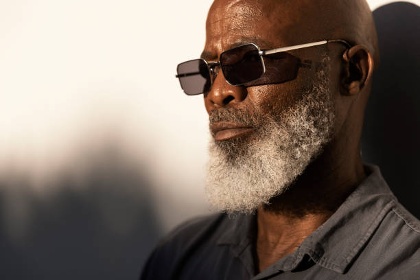 istock Handsome senior man standing outside in the afternoon sun 1407492312