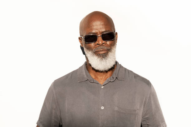 istock Handsome senior man standing outside in the afternoon sun 1407492896