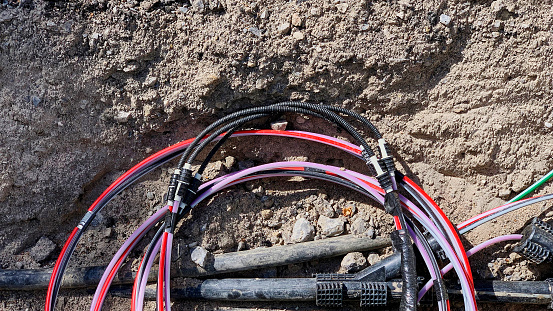 Bundle of electric cables closeup. able bundles in global communication networks. Neat appearance Electrical cables are plugged into the network and marked with labels