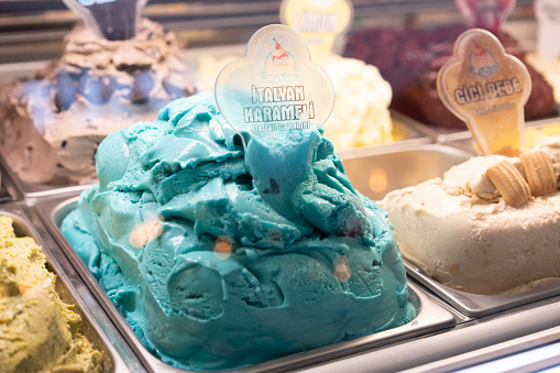 Various  ice cream flavours in modern shop display window