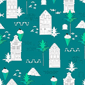 istock African seamless pattern with houses and palm trees on a turquoise background. Vector tropical print for design 1407496700