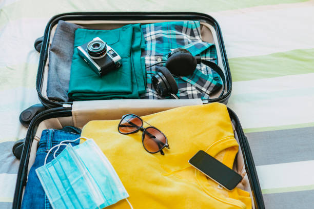 istock Packing suitcase for travel vacation in new normal 1407497959