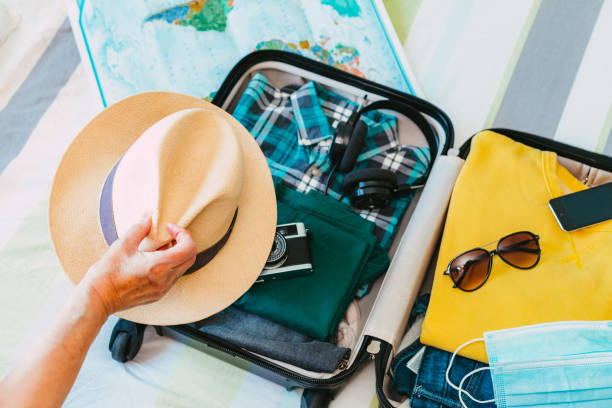 istock Packing suitcase for travel vacation in new normal 1407497961