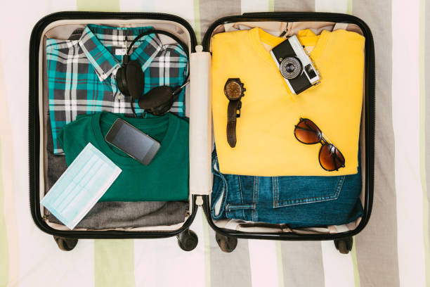 istock Packing suitcase for travel vacation in new normal 1407497989