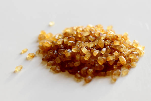 istock brown cane sugar crystals. close-up. 1407499319