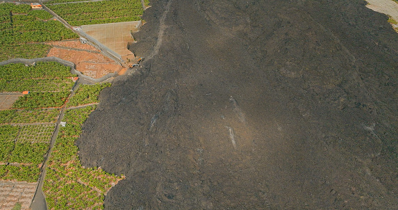 Aerial view of the lava flows at the seashore from the last volcanic eruption of Cumbre Vieja, La Palma. Canary Islands where you can see all the damage caused to banana plantations and houses