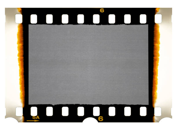 Old 35mm filmstrip or dia slide frame with burned edges isolated on white background.