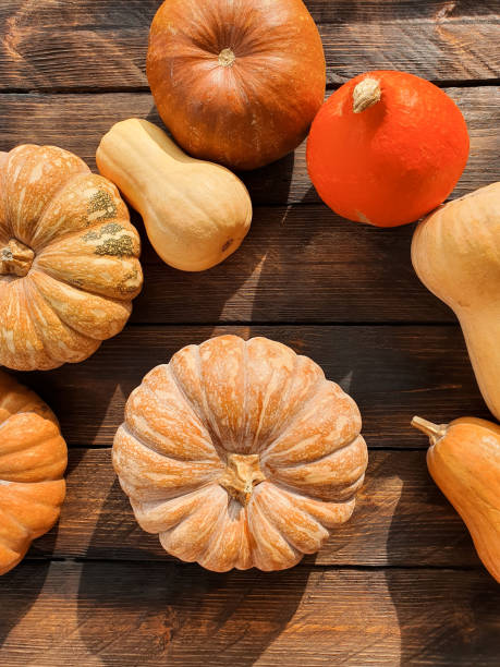 istock There are various pumpkins on the wooden table 1407502711
