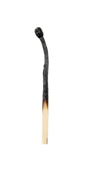 One burnt match isolated on white. Tool for starting fire