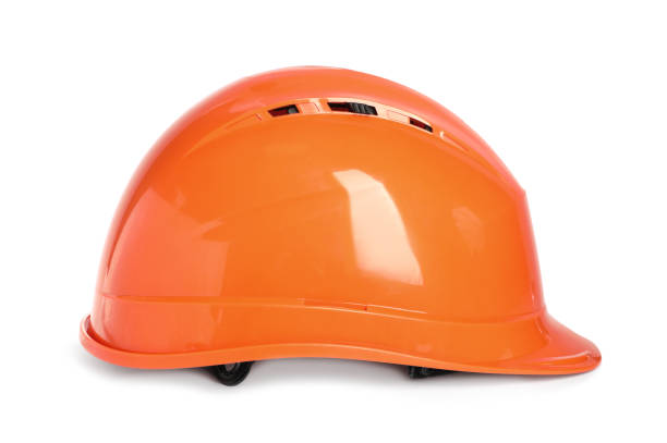 istock Orange hard hat isolated on white. Safety equipment 1407502844