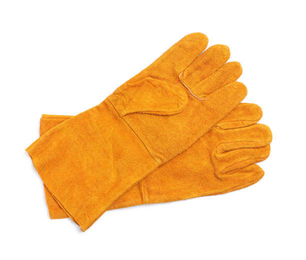 istock Orange protective gloves on white background, top view. Safety equipment 1407502977