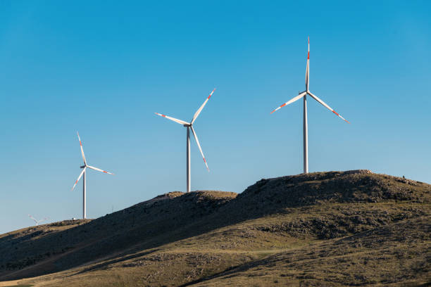 istock clean electricity producing wind turbine or windmill built on a windy mountain ridge 1407505705