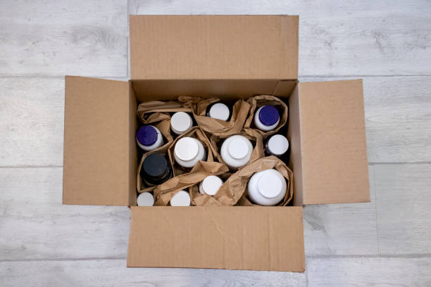 istock Full cardboard box with jars of vitamins and dietary supplements 1407509512