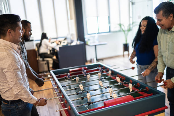 istock Coworkers playing in a foosball table 1407509949