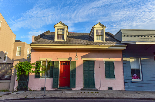 New Orleans, LA, USA - June 29, 2022: View of the traditional and historic architecture of the French Quarter including St. Louis Cathedral in New Orleans. The French Quarter, also known as the Vieux Carré, is the oldest neighborhood in the city of New Orleans.