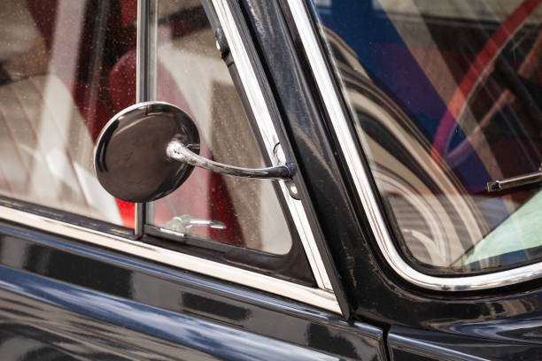 istock Side rearview mirror in round chromed frame, old car 1407513599