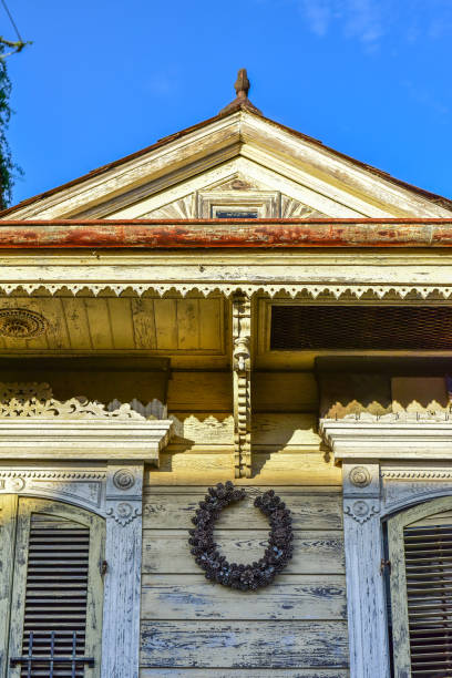View of a weathered facade of historic house of the French Quarter in New Orleans. The French Quarter, also known as the Vieux Carré, is the oldest neighborhood in the city of New Orleans.