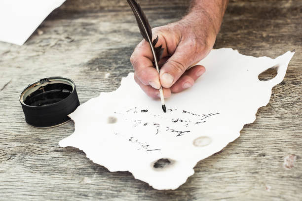 istock a quill and a sheet of paper 1407516029