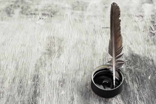 istock a quill and a sheet of paper 1407516221