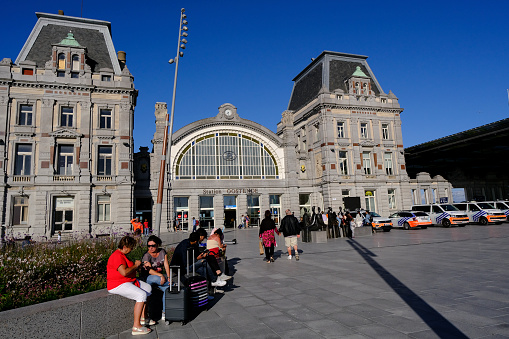 Passengers walk after a commuter train arrived at Central railway station in Ostend, Belgium on Jul. 3, 2022.
