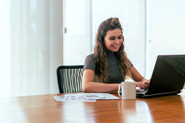 istock Young woman working in a office. 1407519309