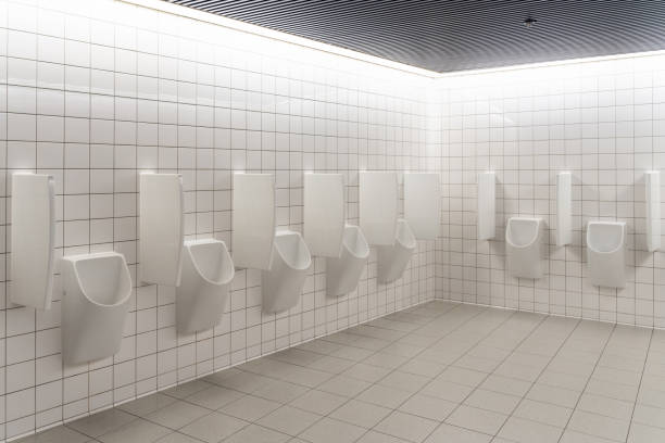 white men urinals on tiles wall - urinal clean contemporary in a row imagens e fotografias de stock