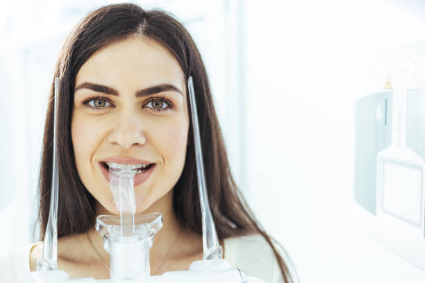 istock Patient standing in x-ray machine at dental clinic 1407523857