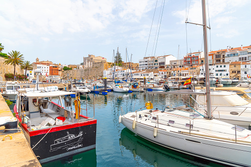 Fishing boats, sailboats and yachts at the picturesque Port of Ciutadella on the Balearic island of Minorca or Menorca Spain.