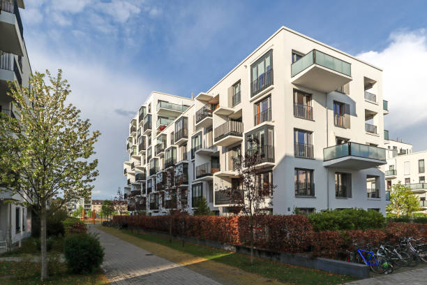 Cityscape of a residential area with modern apartment buildings, new green urban landscape in the city Cityscape of a residential area with modern apartment buildings, new green urban landscape in the city green building blocks stock pictures, royalty-free photos & images