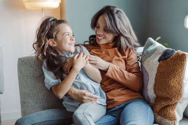 istock Young mom and smiling little daughter spending time together 1407527326