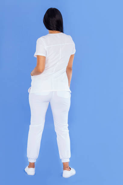 istock Latin woman in studio with blue background wearing her crew uniform 1407527592